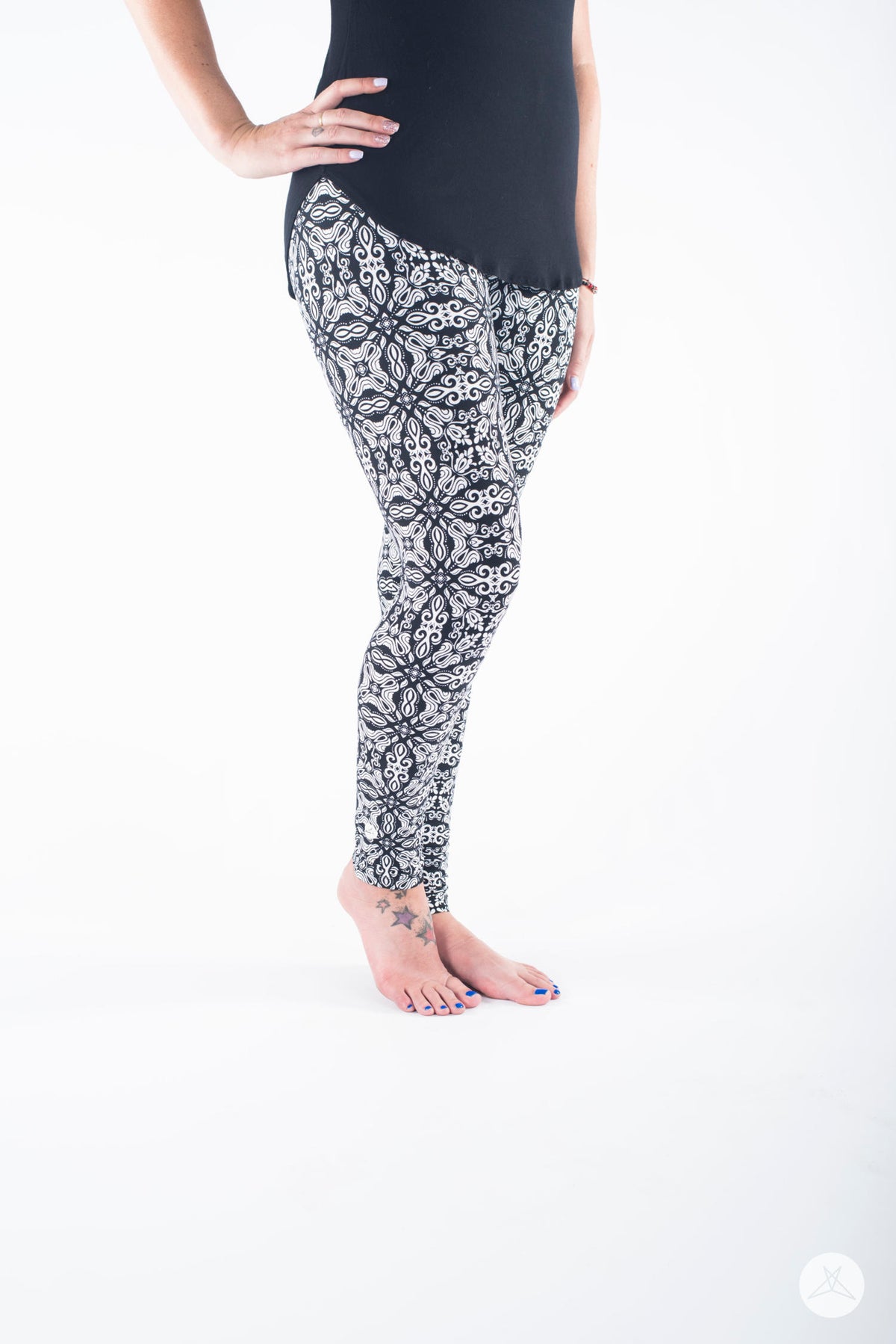SweetLegs Vault - Signature Leggings in black and white ornate floral pattern modeled with a black tunic