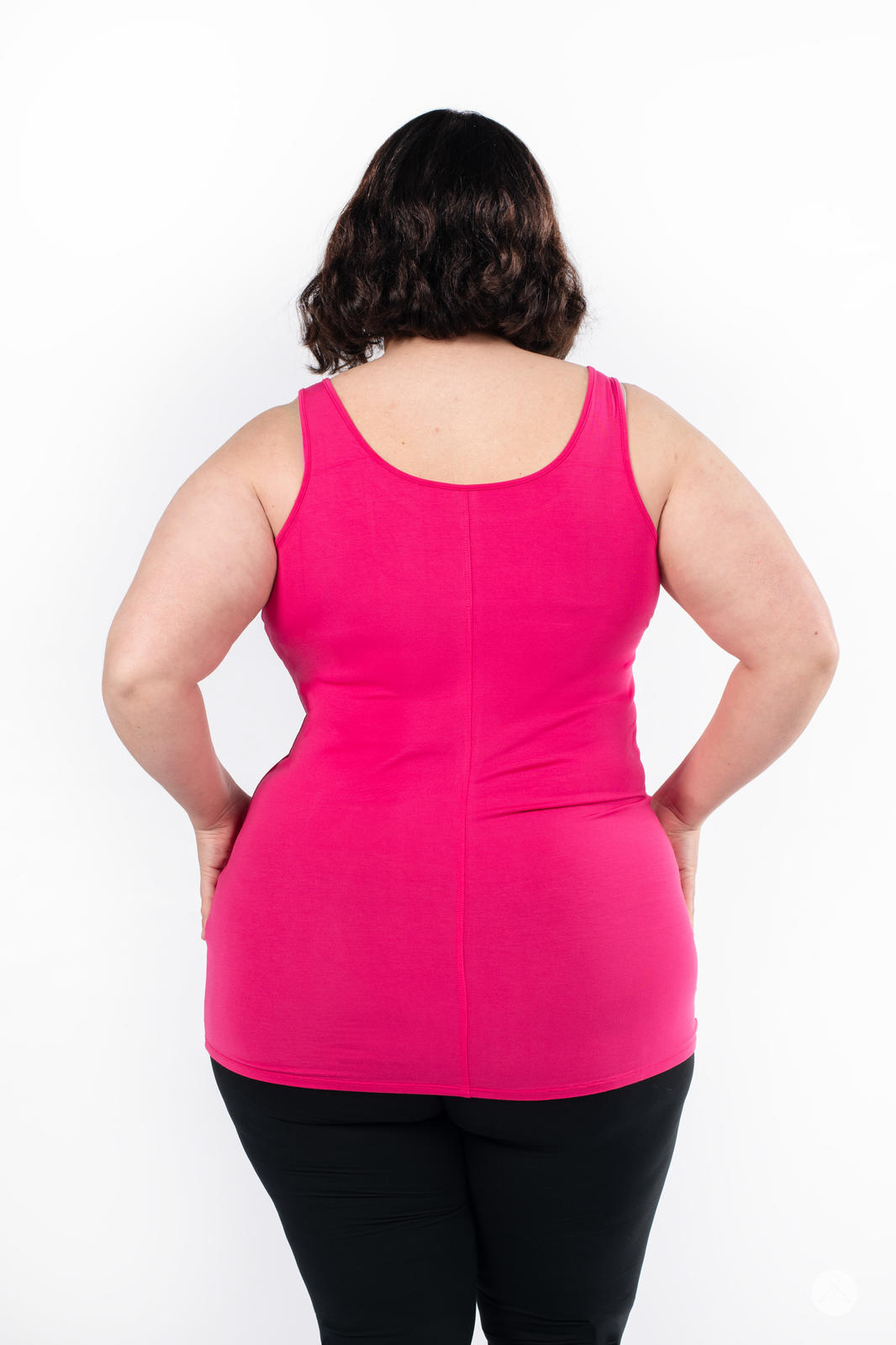 Plus size woman shown from back wearing bright raspberry Classic Layering Tank by SweetLegs Canada with black leggings