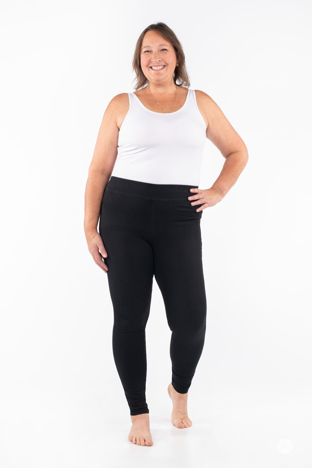 Plus-size model in SweetLegs Denim High-Waisted Pocket Leggings black with comfortable breathable stretch fit