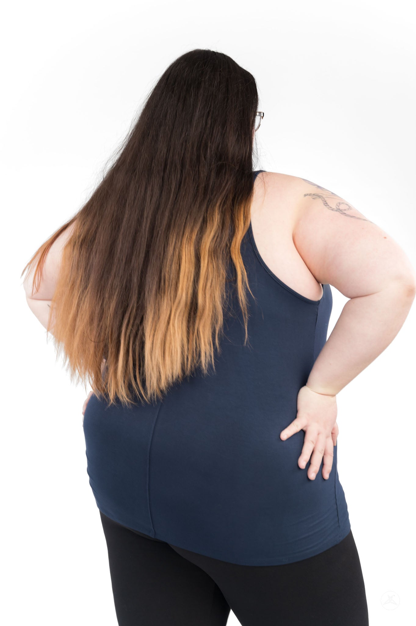 Plus size woman with long ombre hair wearing a navy Classic Tank (Copy) by SweetLegs Canada shown from back