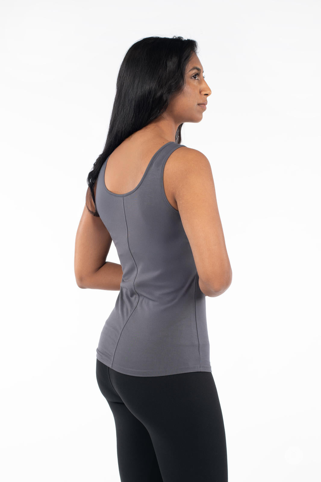 Woman wearing SweetLegs Canada Classic Tank in grey, shown from back with black leggings on white background