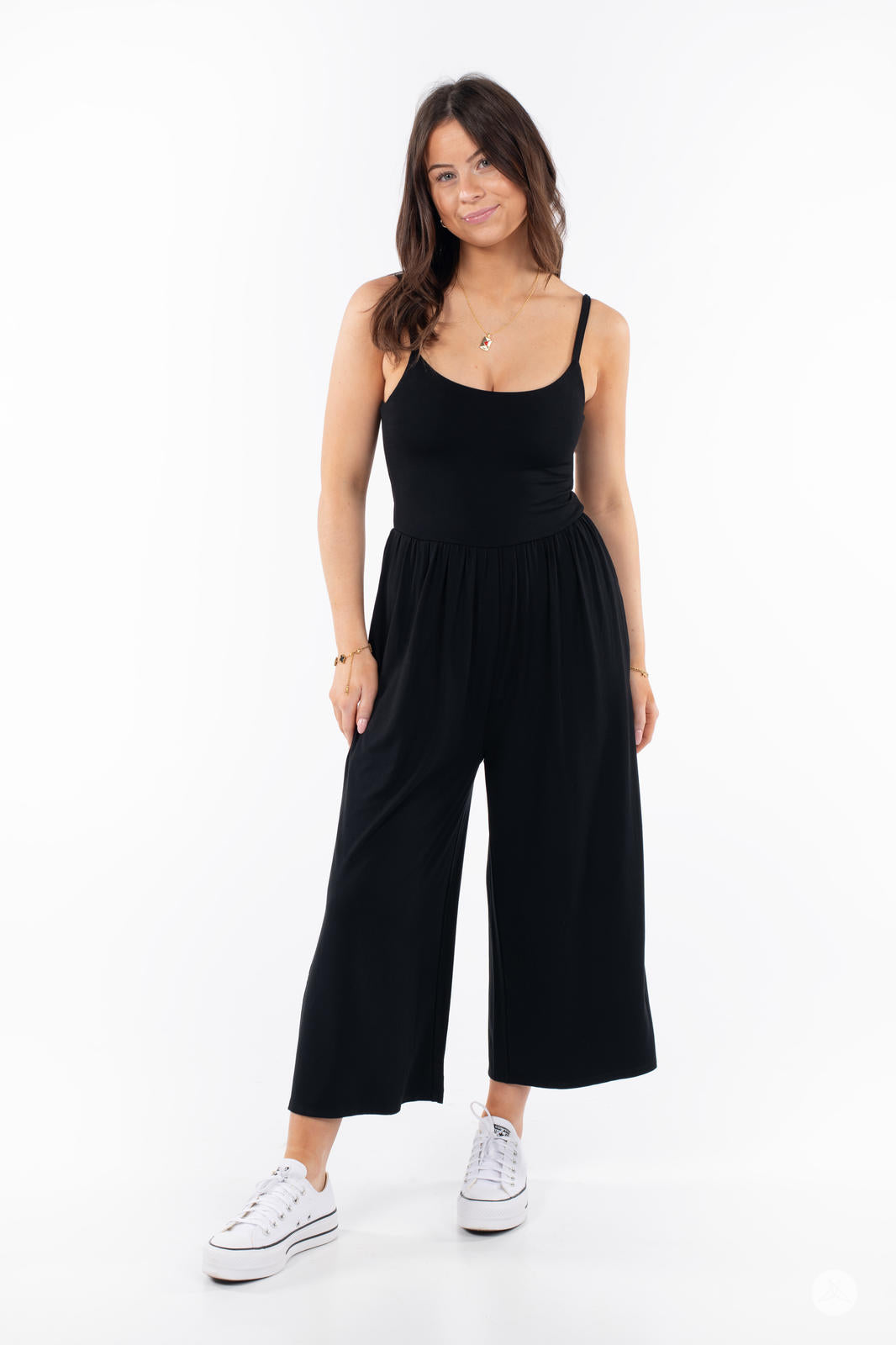 Woman wearing black SweetLegs Cropped Wide Leg Jumpsuit with thin straps and relaxed fit front view