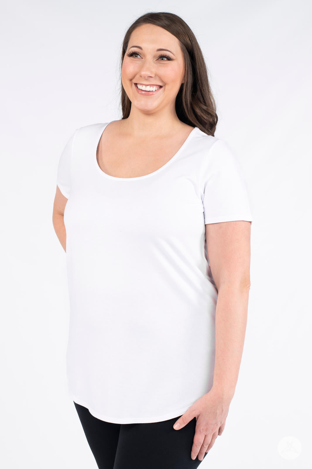 Smiling model wearing white Classic Tee by SweetLegs Canada with scoop neckline and short sleeves facing front