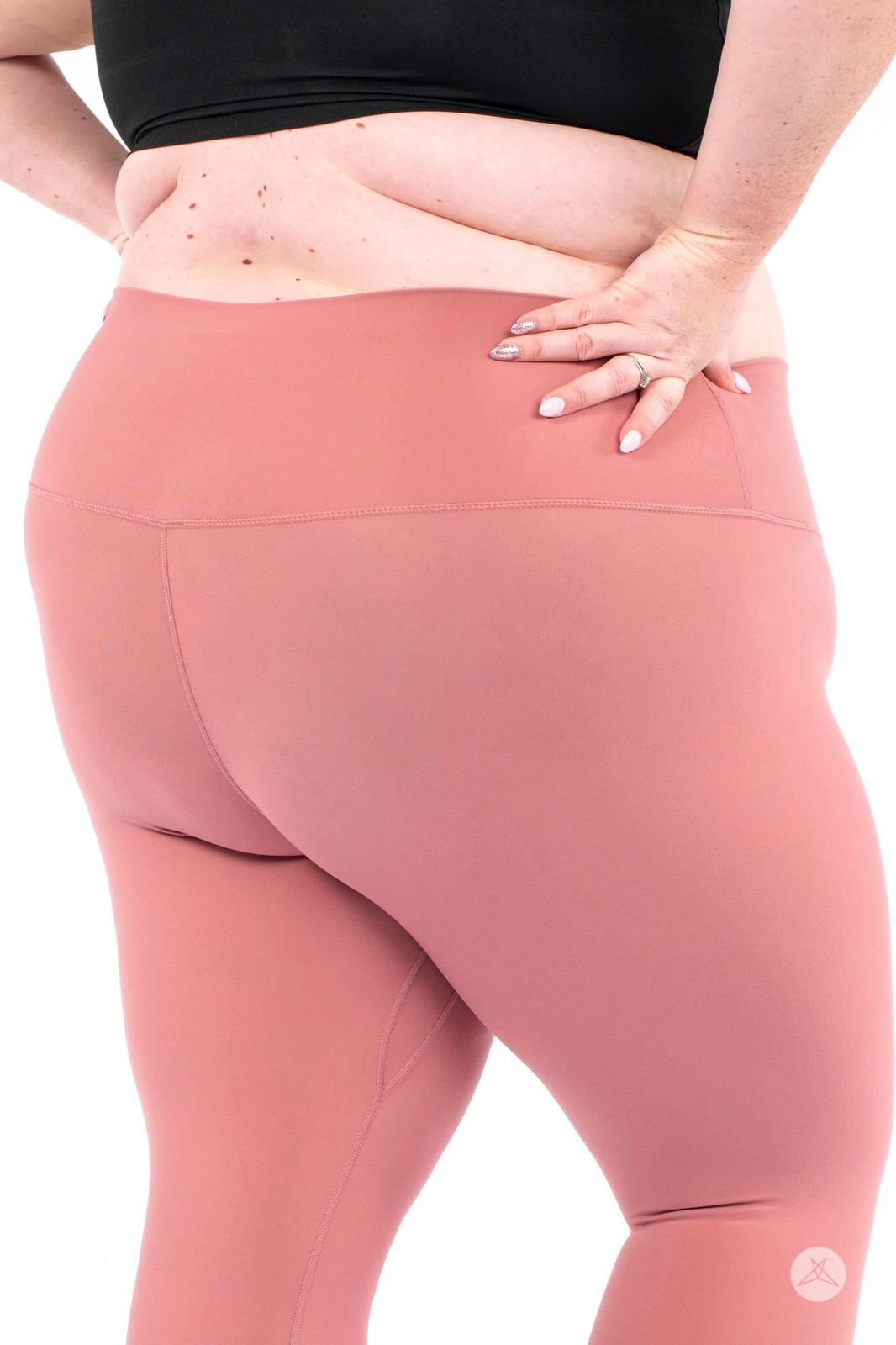 Plus size model showcasing dusty rose Free Motion Crops by Athleisure from SweetLegs collection back view