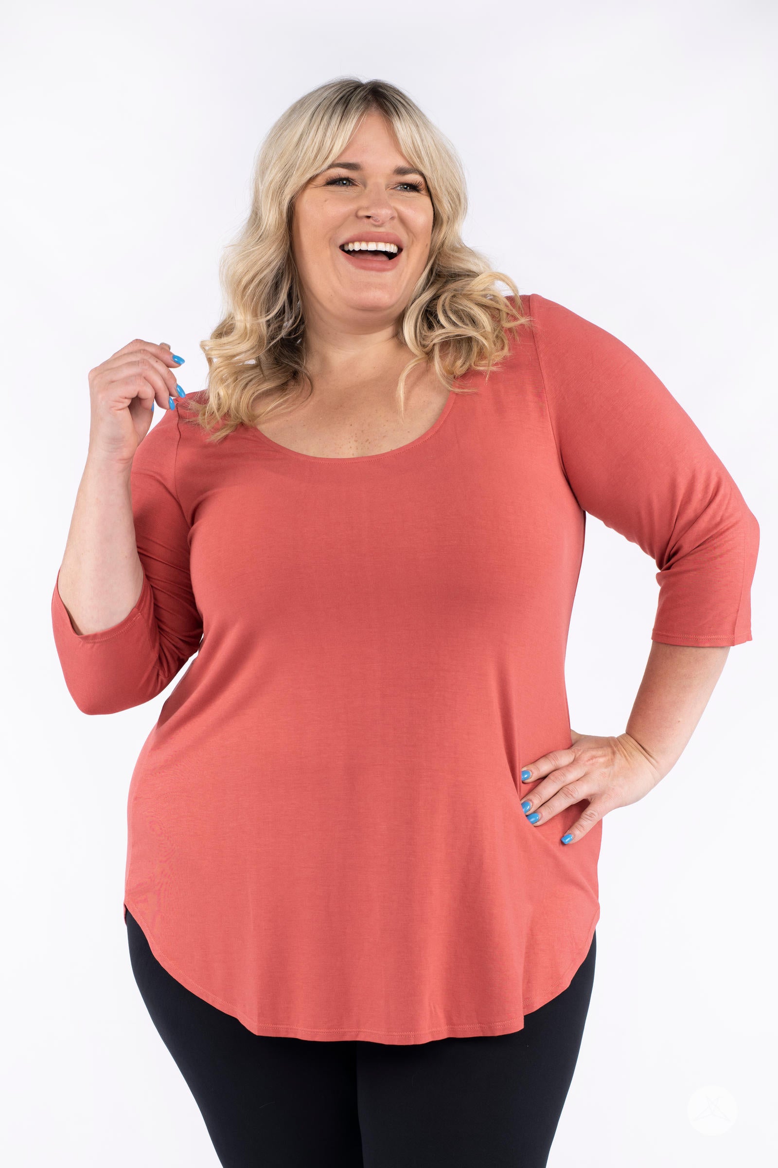 Classic 3/4 Tee by SweetLegs Canada in warm coral with scoop neckline and relaxed fit on happy plus-size model front view
