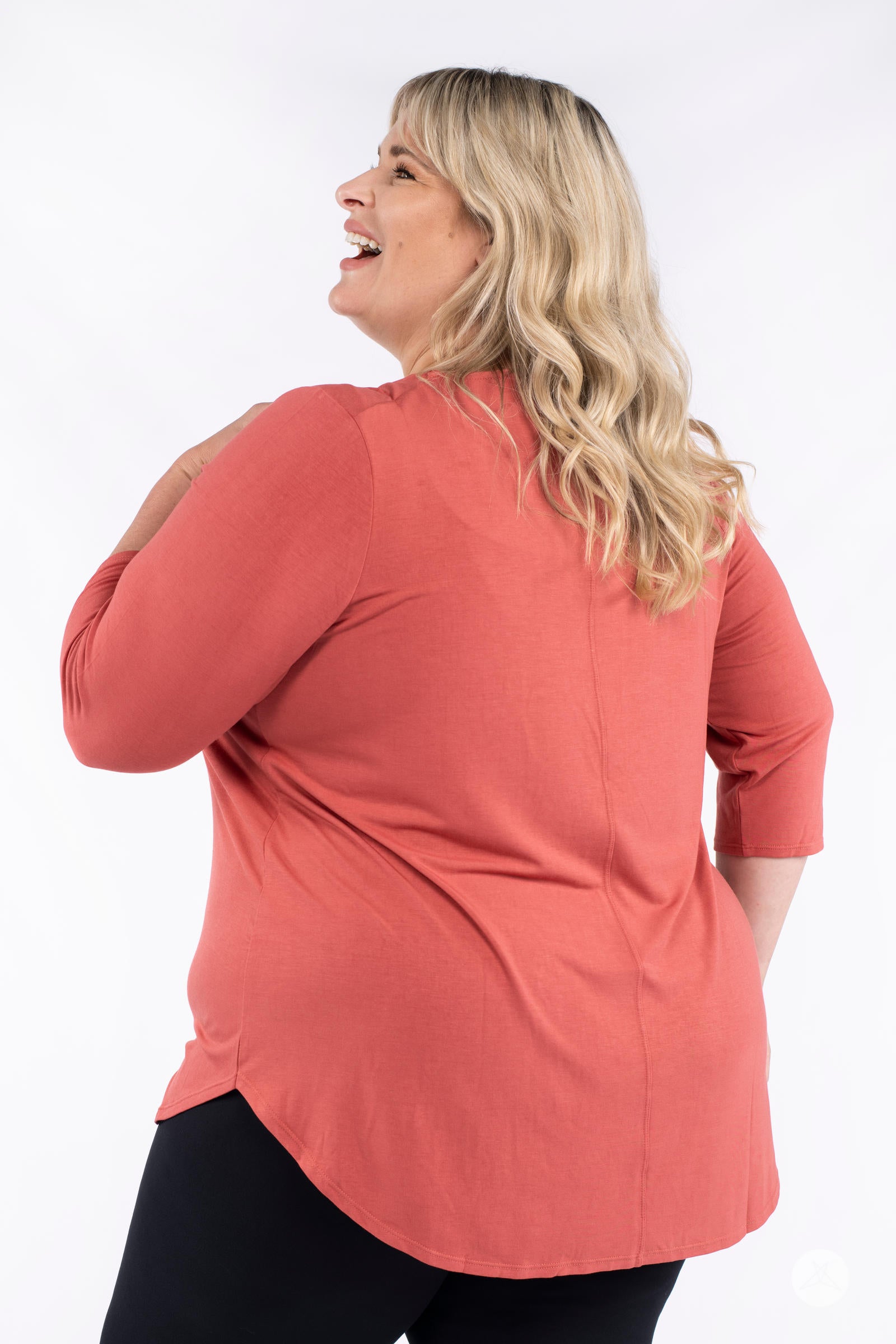 Classic 3/4 Tee by SweetLegs Canada in warm coral with high-low hem shown on plus-size model back view