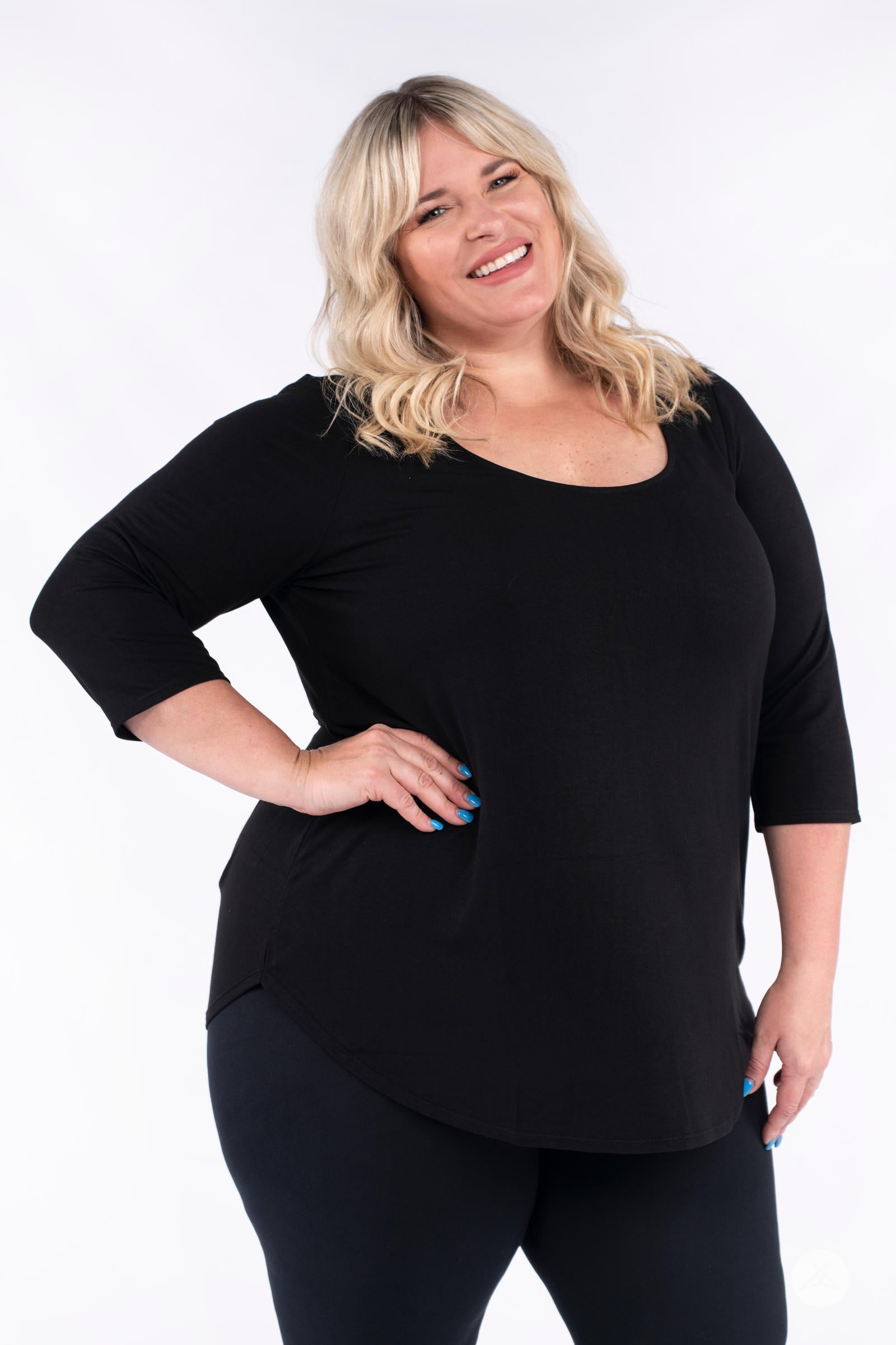 Classic 3/4 Tee by SweetLegs Canada in black with scoop neck and high-low hem shown on smiling plus-size model front view