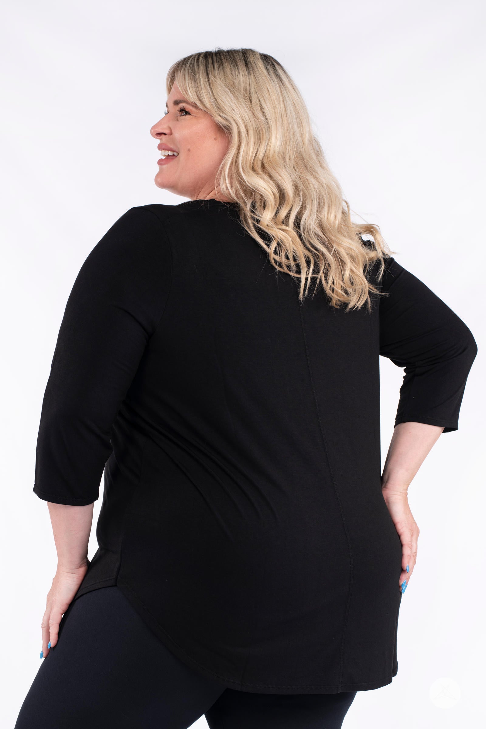 Classic 3/4 Tee by SweetLegs Canada in black with 3/4 sleeves and high-low hem shown on smiling plus-size model back view