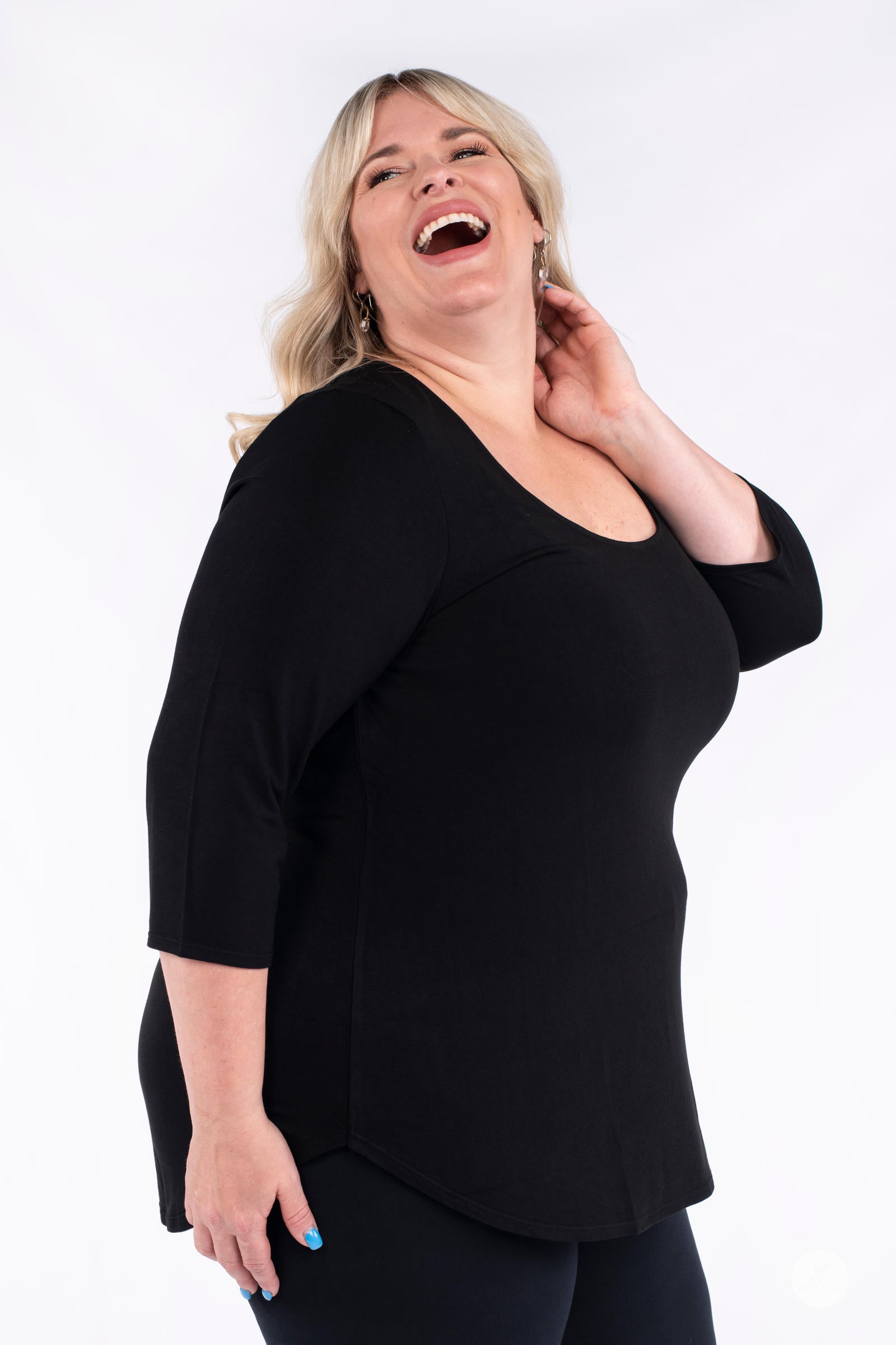 Classic 3/4 Tee by SweetLegs Canada in black with fitted sleeves and scoop neck shown on laughing plus-size model side view