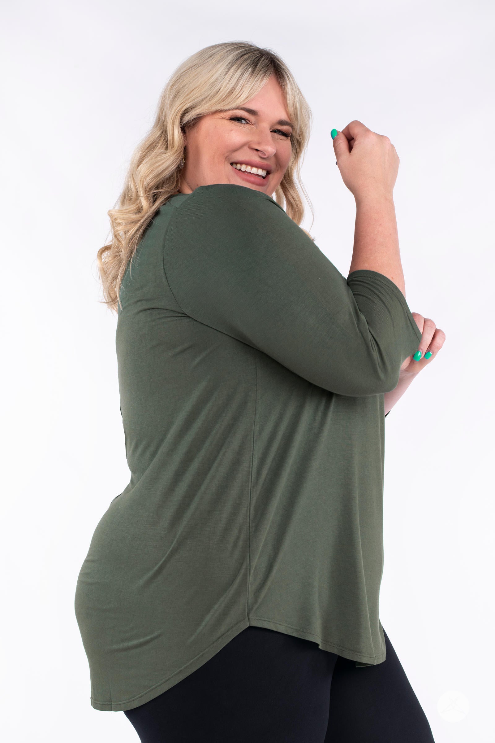 Classic 3/4 Tee by SweetLegs Canada in olive with high-low hem and relaxed fit on smiling plus-size model side view
