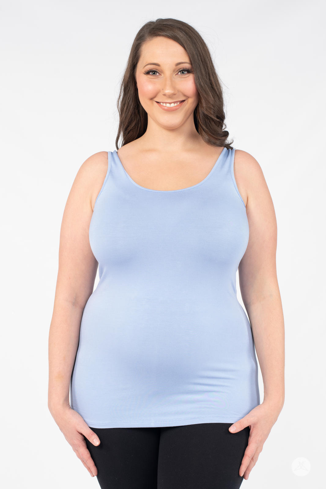 Woman wearing SweetLegs Canada Classic Layering Tank in light blue with a soft, smooth fit and relaxed look on white background