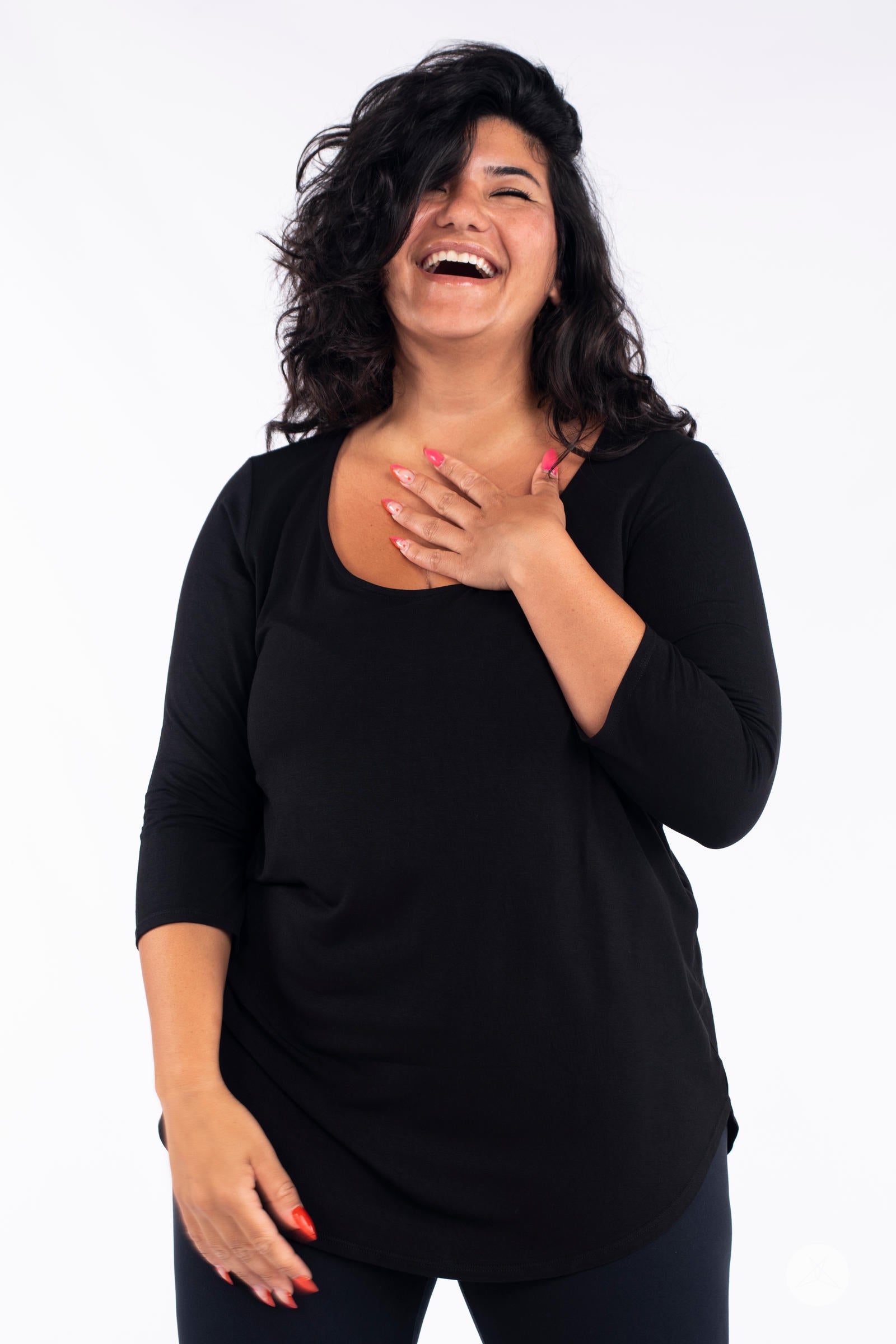 Classic 3/4 Tee by SweetLegs Canada in black with scoop neck and fitted sleeves on laughing plus-size model front view