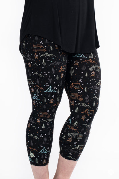 Plus size model wearing Vault - Signature Crops by SweetLegs with camping and mountain pattern on black background
