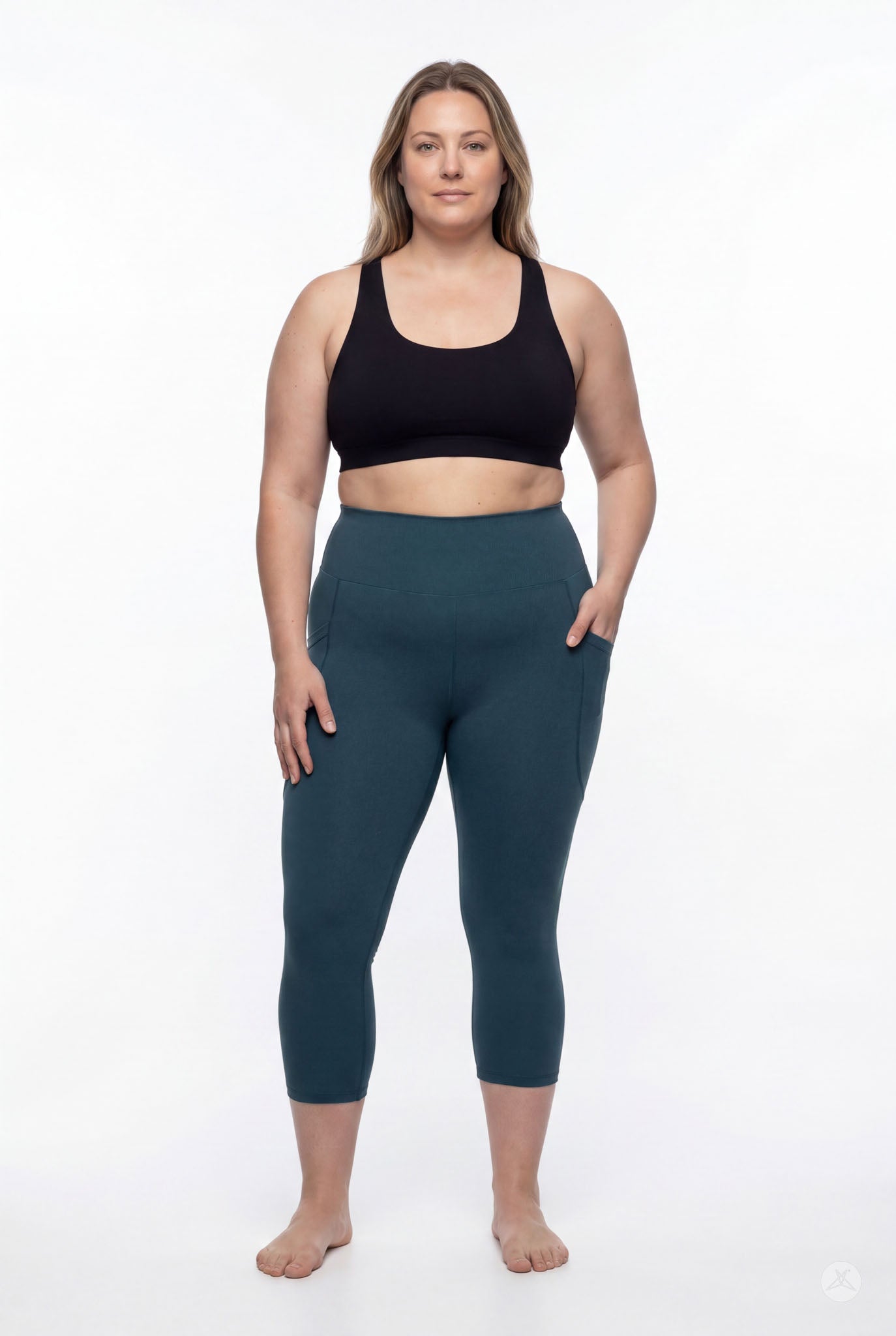 Plus size woman standing barefoot wearing SweetLegs Deep Teal High-Waisted Pocket Crops with hand in pocket front view