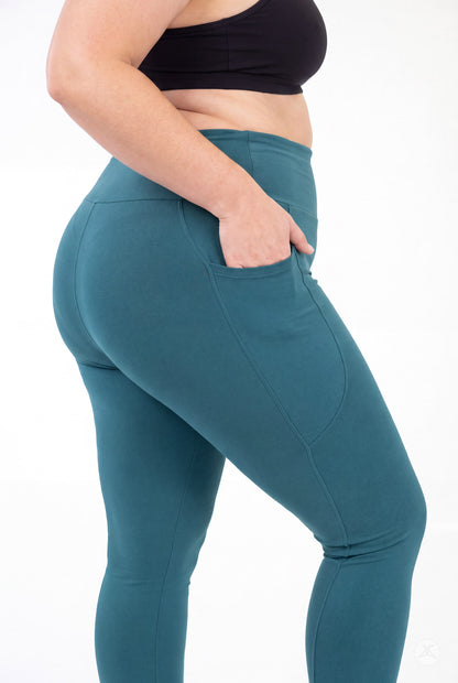 SweetLegs Deep Teal High-Waisted Pocket Leggings shown in profile with hand in side pocket