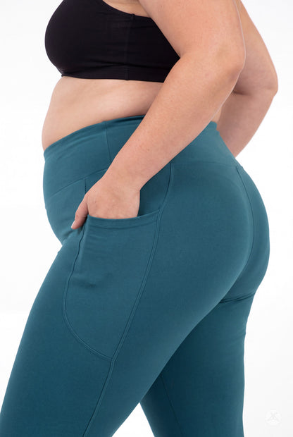 SweetLegs Deep Teal High-Waisted Pocket Leggings shown in profile with hand in side pocket