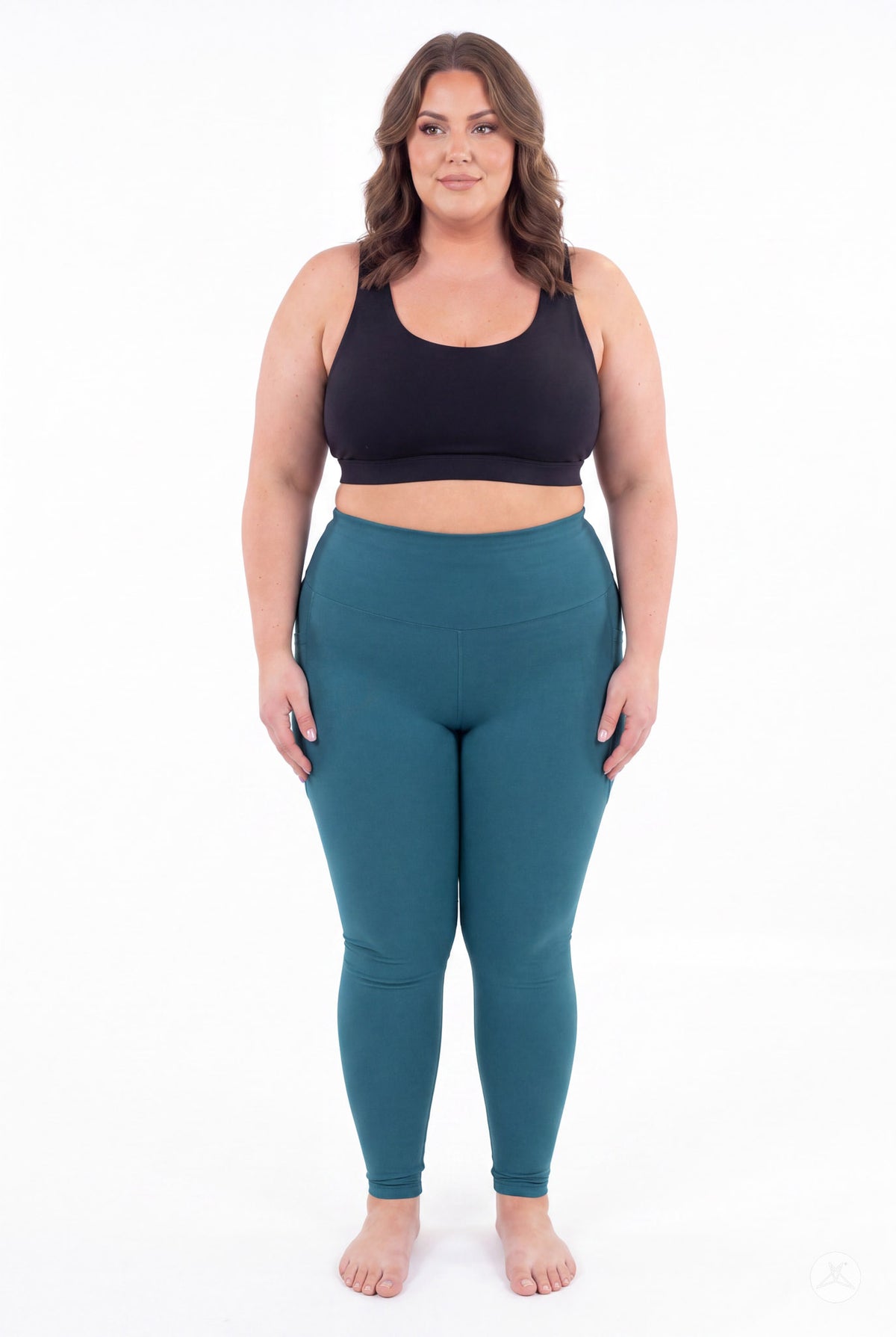 SweetLegs Deep Teal High-Waisted Pocket Leggings modeled by a smiling woman in a black sports bra