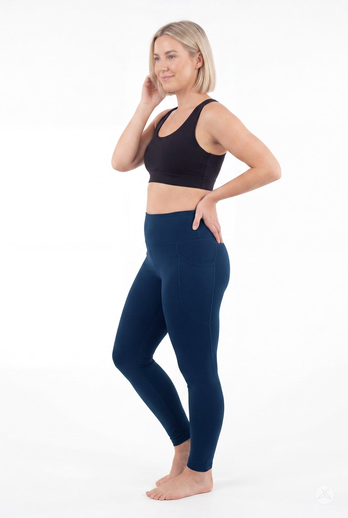 SweetLegs Still Water High-Waisted Pocket Leggings worn by a model standing barefoot in a black top