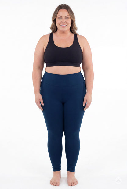 SweetLegs Still Water High-Waisted Pocket Leggings worn by a smiling model in a black top barefoot