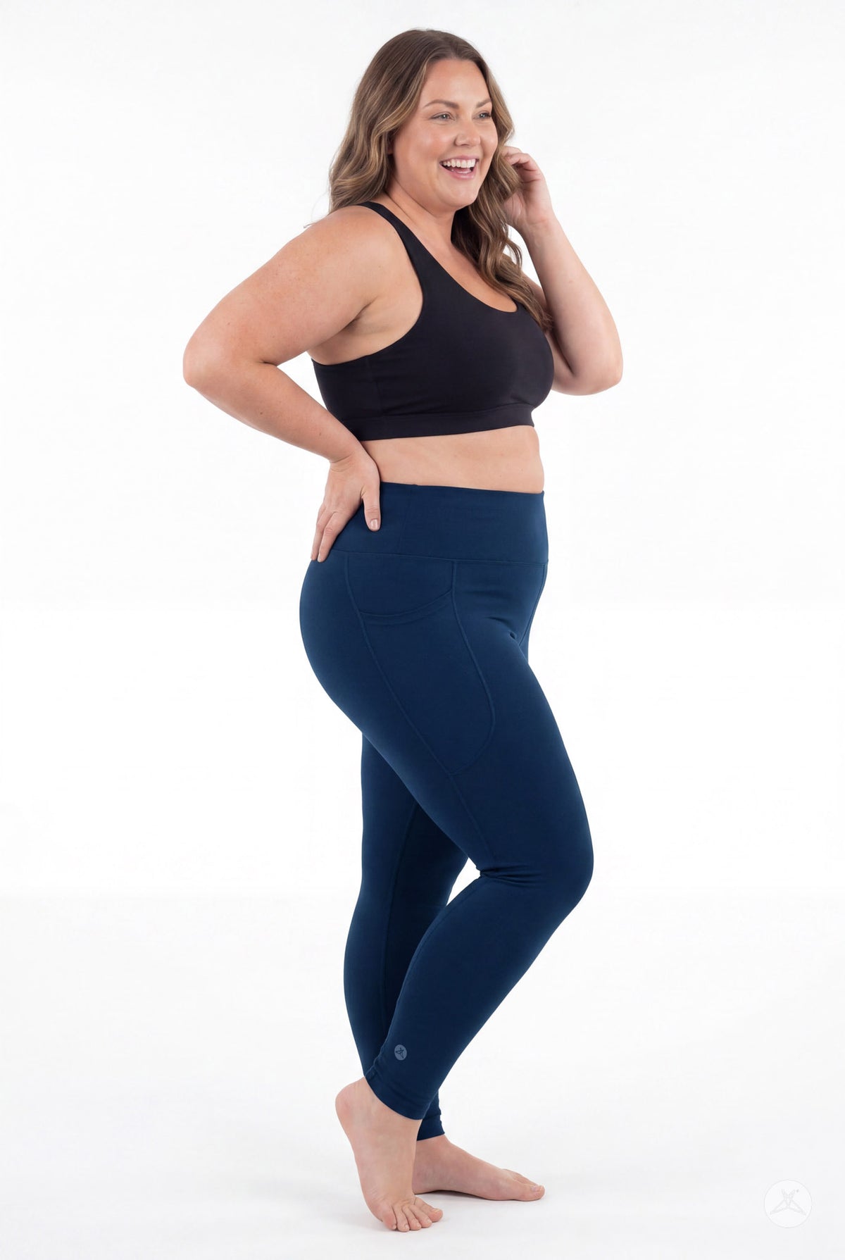SweetLegs Still Water High-Waisted Pocket Leggings worn by a smiling barefoot model in a black crop top