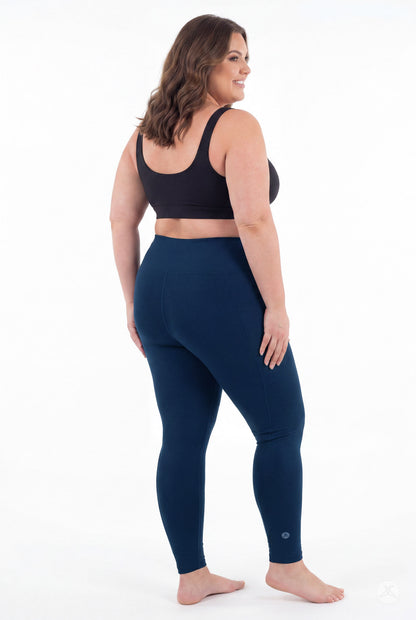 SweetLegs Still Water High-Waisted Pocket Leggings modeled barefoot in a black crop top from behind