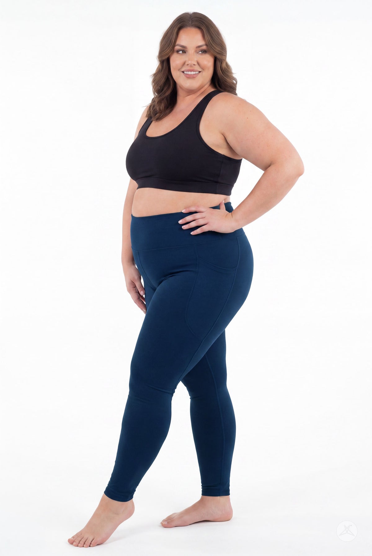 SweetLegs Still Water High-Waisted Pocket Leggings modeled by a smiling woman in a black crop top barefoot