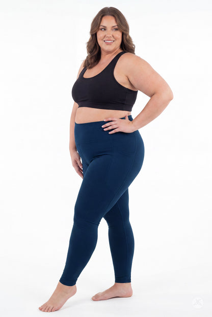 SweetLegs Still Water High-Waisted Pocket Leggings modeled by a smiling woman in a black crop top barefoot