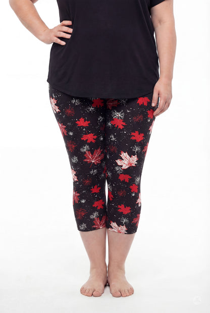 Plus size model in SweetLegs Maple Mood Crops with red maple leaf pattern and black short sleeve top standing barefoot