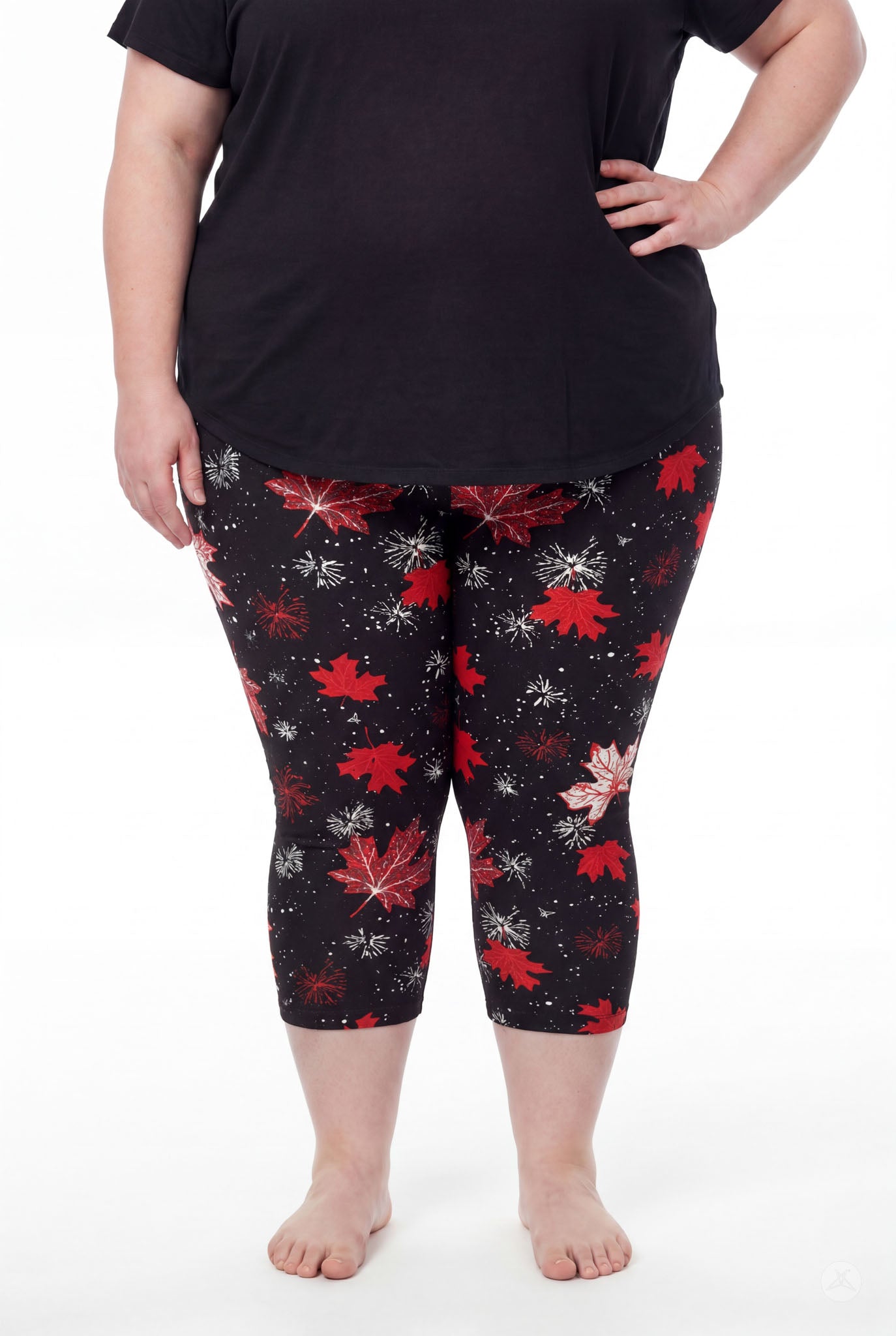 Plus size woman wearing SweetLegs Maple Mood Crops with red and white leaf print and black top barefoot standing front view