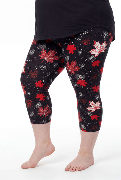 Plus size model wearing SweetLegs Maple Mood Crops with red maple leaf pattern and black top barefoot side view