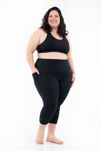 SweetLegs High-Waist Pocket Crops in black worn by a smiling woman with side pockets
