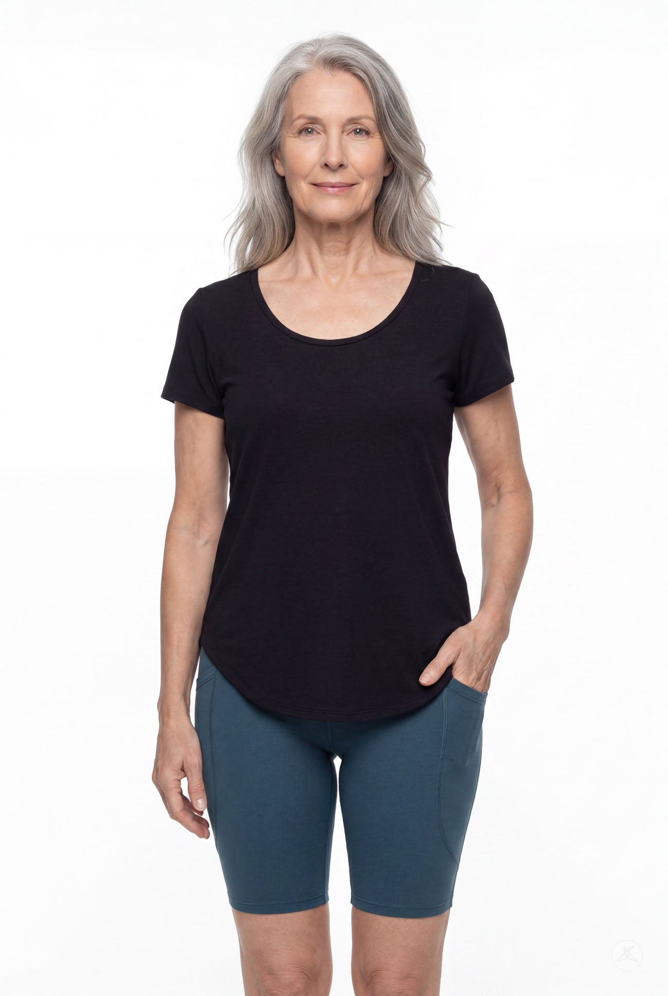 Mature woman wearing SweetLegs Deep Teal Pocket Biker Shorts with side pockets and black scoop neck top front view