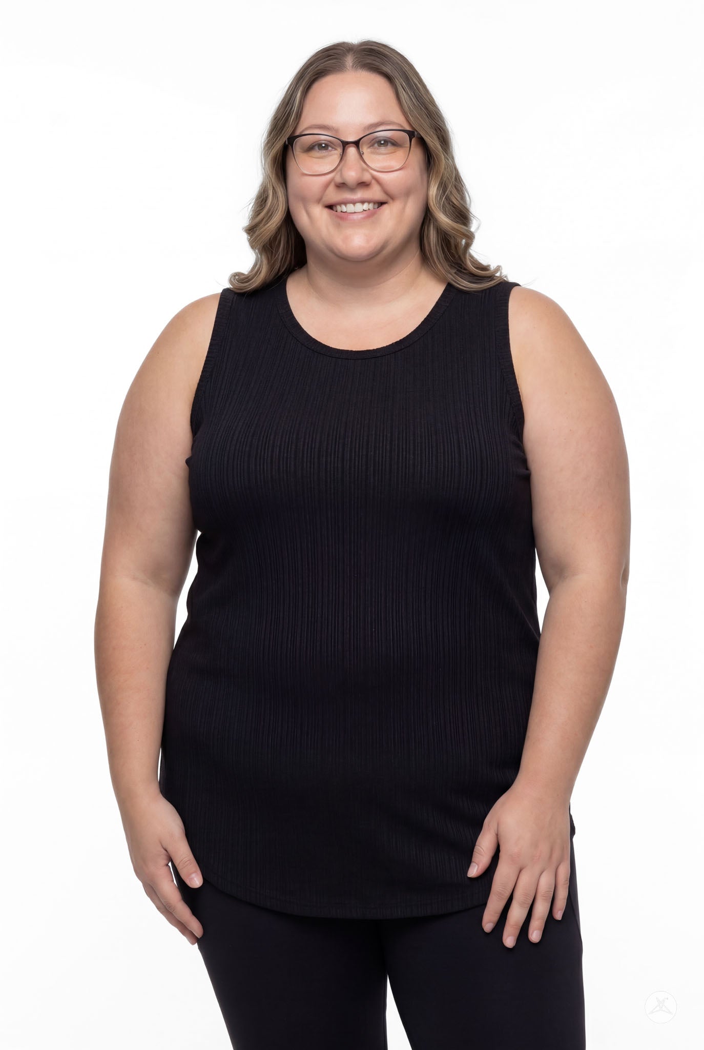 Smiling woman wearing SweetTops The Soft Ribbed Tank in black with glasses and relaxed pose, front view