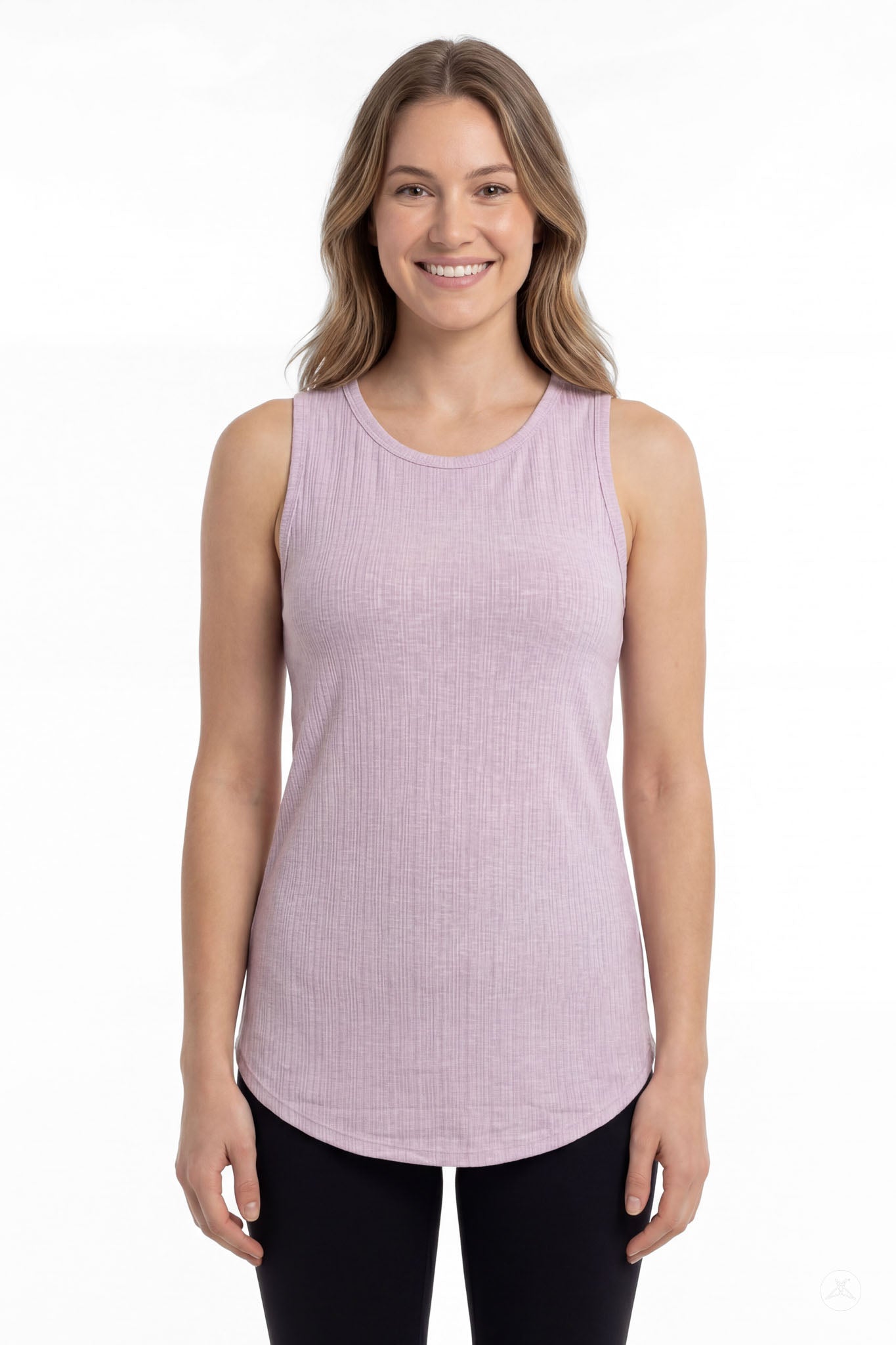 Smiling model wearing SweetTops The Soft Ribbed Tank in lilac with black leggings, front view