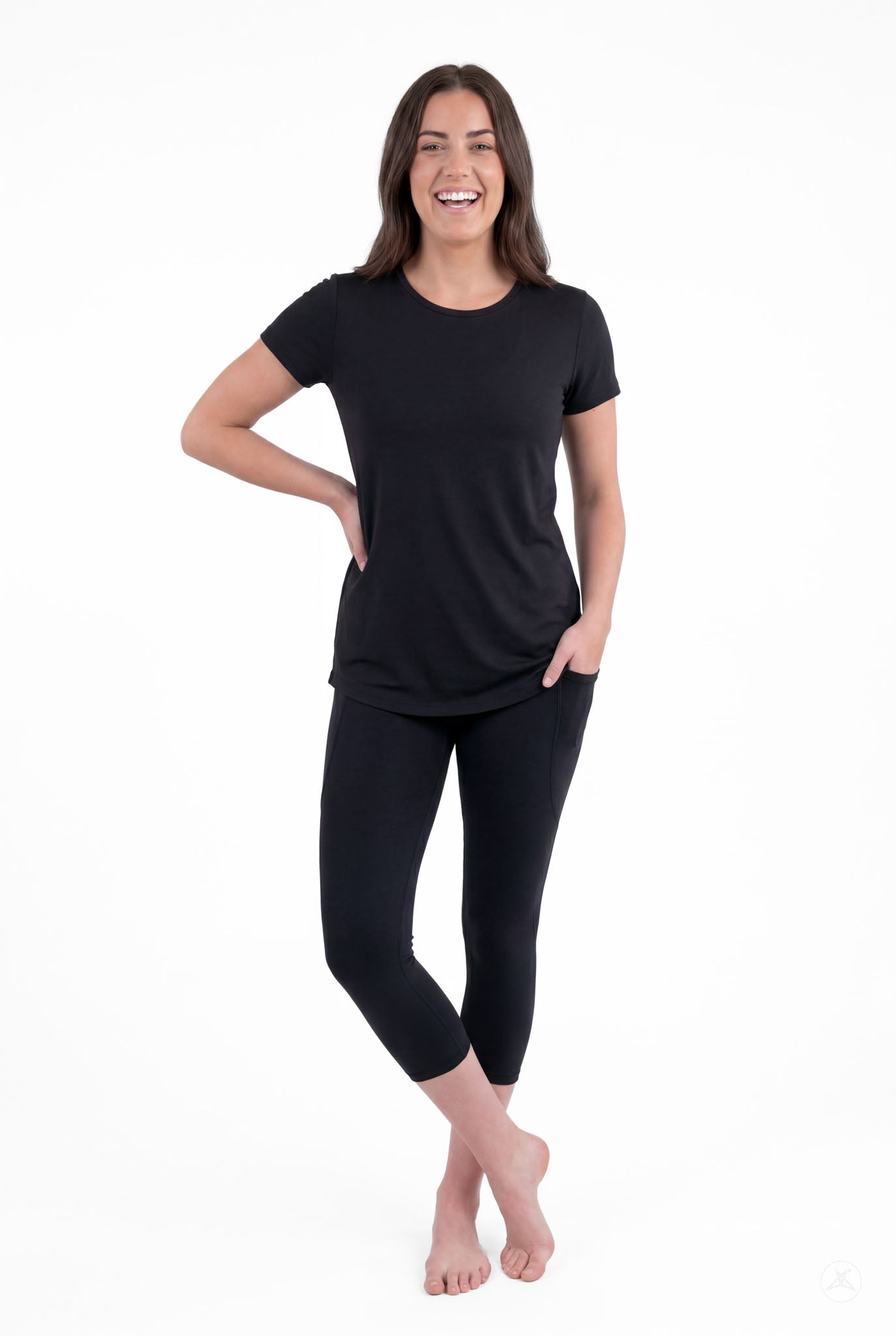 Smiling woman posing barefoot wearing SweetLegs Black Pocket Crops with pockets and black short sleeve top