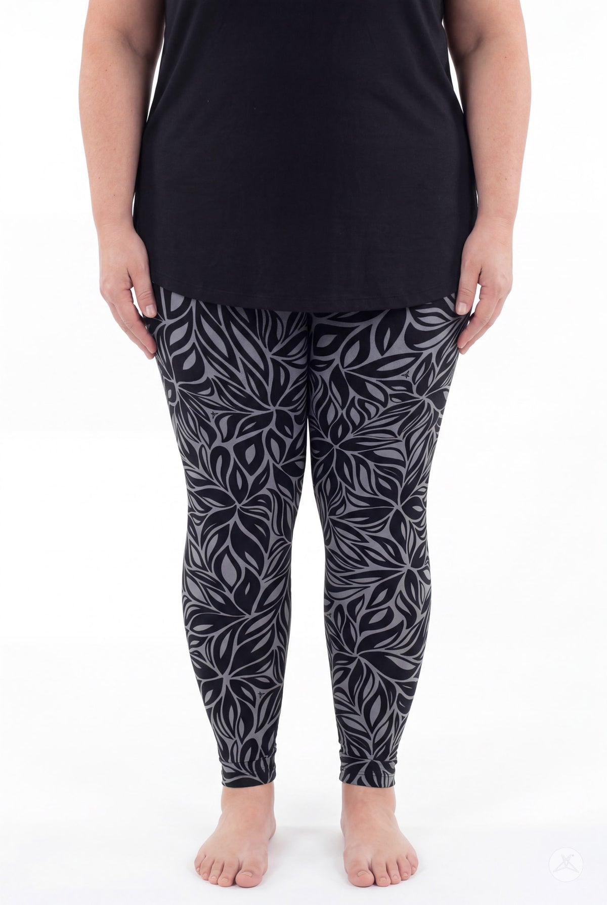 SweetLegs Shadow Petal Leggings modeled by a woman in a black and gray leafy pattern