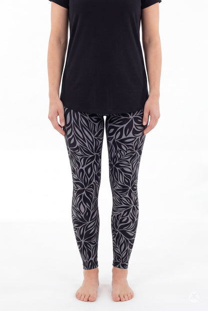 SweetLegs Shadow Petal Leggings modeled in a black and gray leafy botanical print