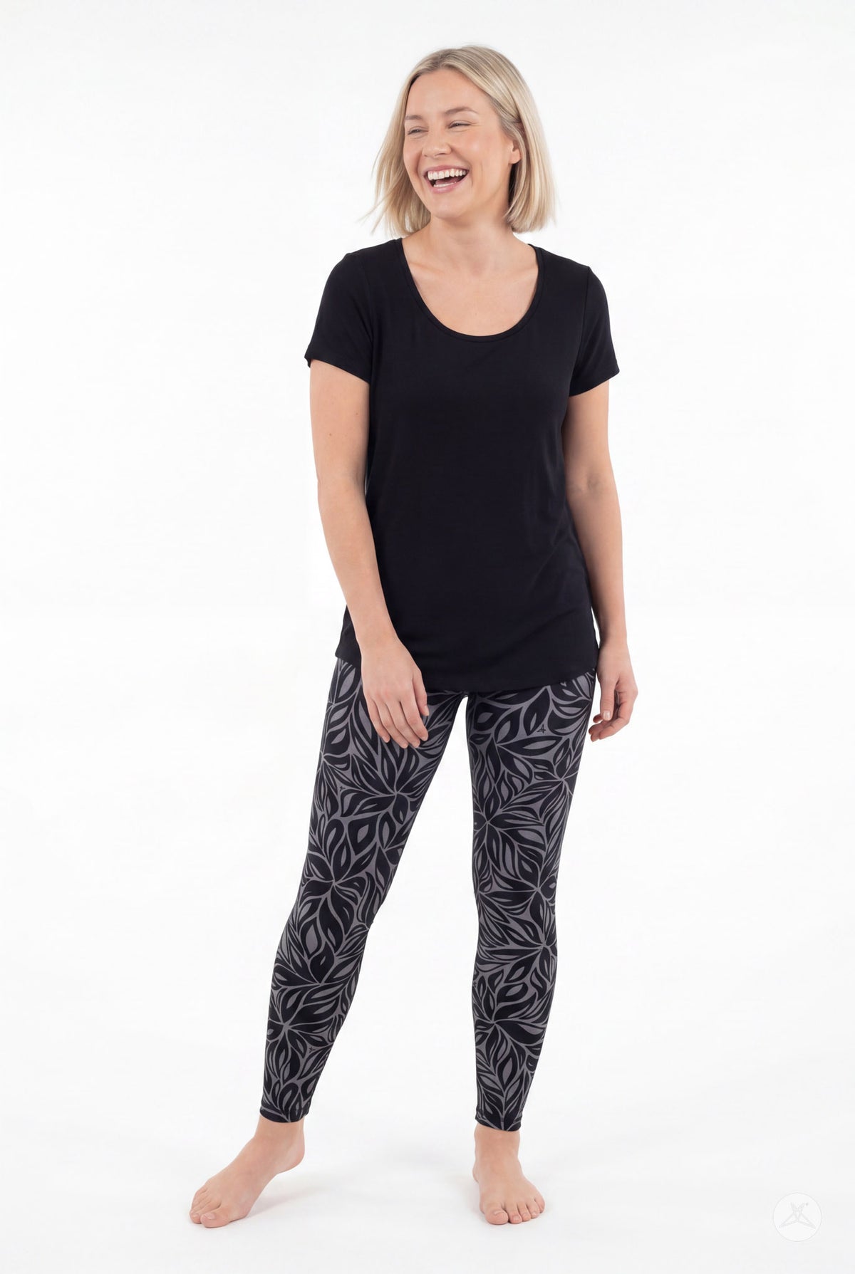 SweetLegs Shadow Petal Leggings worn by a woman in a black and gray leafy pattern