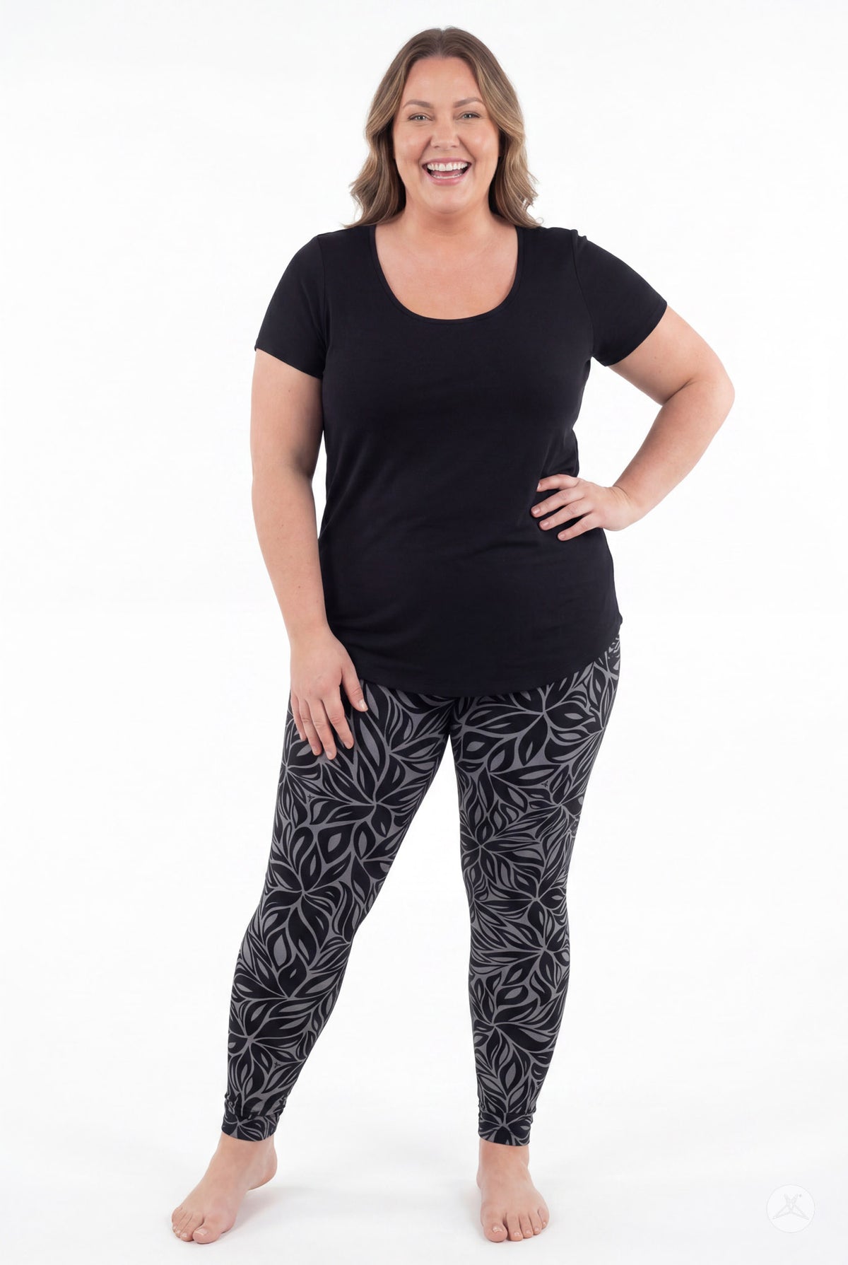 SweetLegs Shadow Petal Leggings worn by a smiling woman in a black and gray botanical print