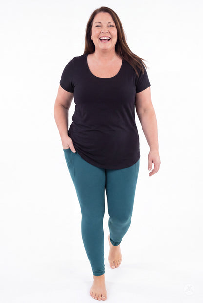SweetLegs Deep Teal Pocket Leggings worn by a smiling model in a black top