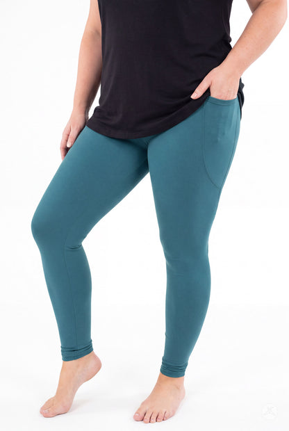 SweetLegs Deep Teal Pocket Leggings worn by a model with one hand in the side pocket