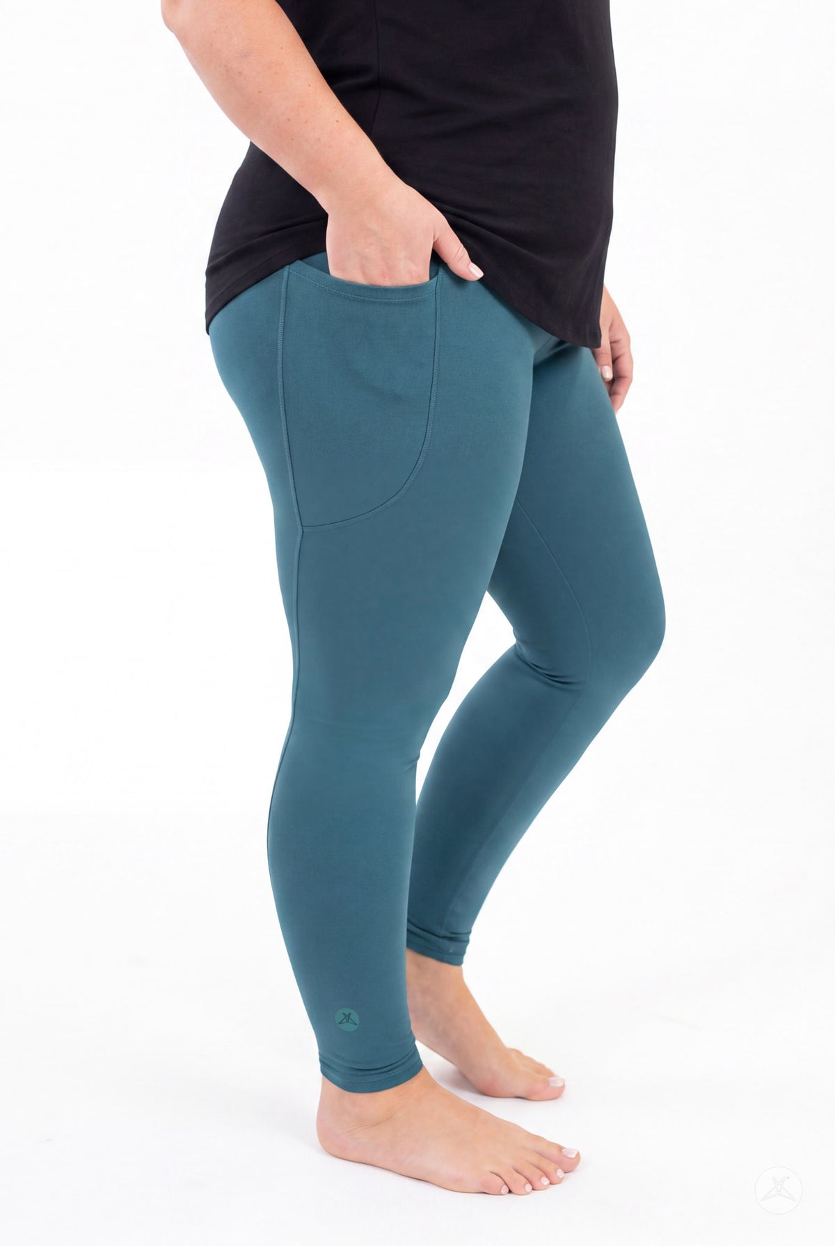 SweetLegs Deep Teal Pocket Leggings worn by a model with one hand in the side pocket