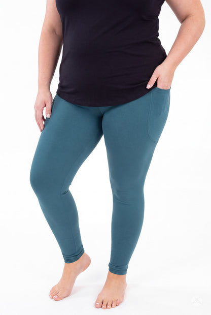 SweetLegs Deep Teal Pocket Leggings worn by a model in a black top with one hand in a side pocket