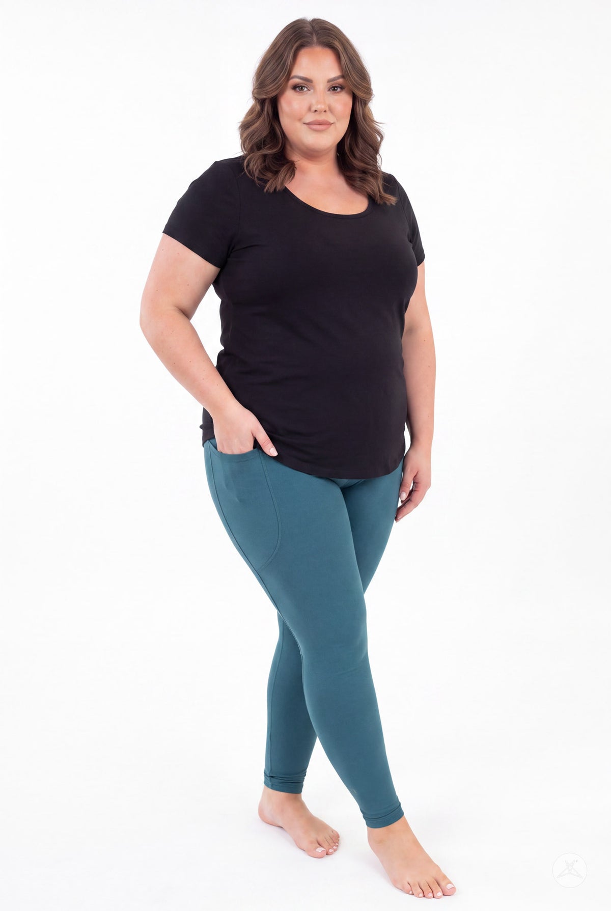 SweetLegs Deep Teal Pocket Leggings worn by a model in a black top with crossed legs