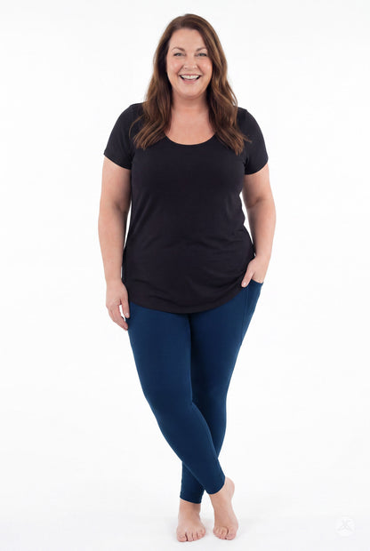 SweetLegs Still Water Pocket Leggings in navy blue worn by a smiling model