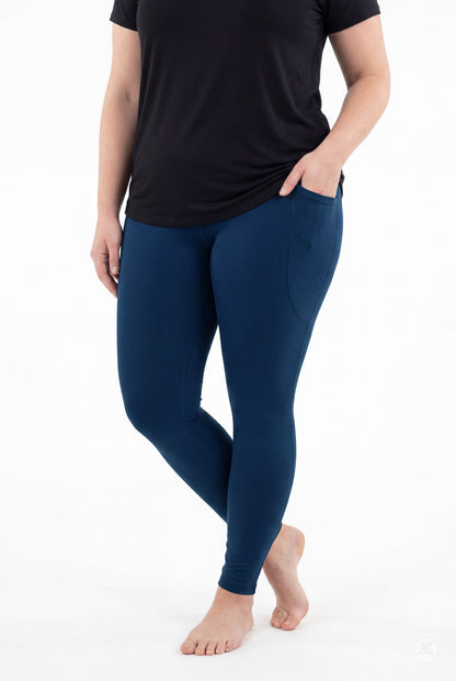 SweetLegs Still Water Pocket Leggings in navy blue worn by a model with side pockets
