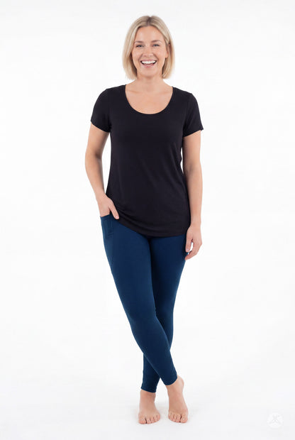 SweetLegs Still Water Pocket Leggings in navy blue worn by a smiling model