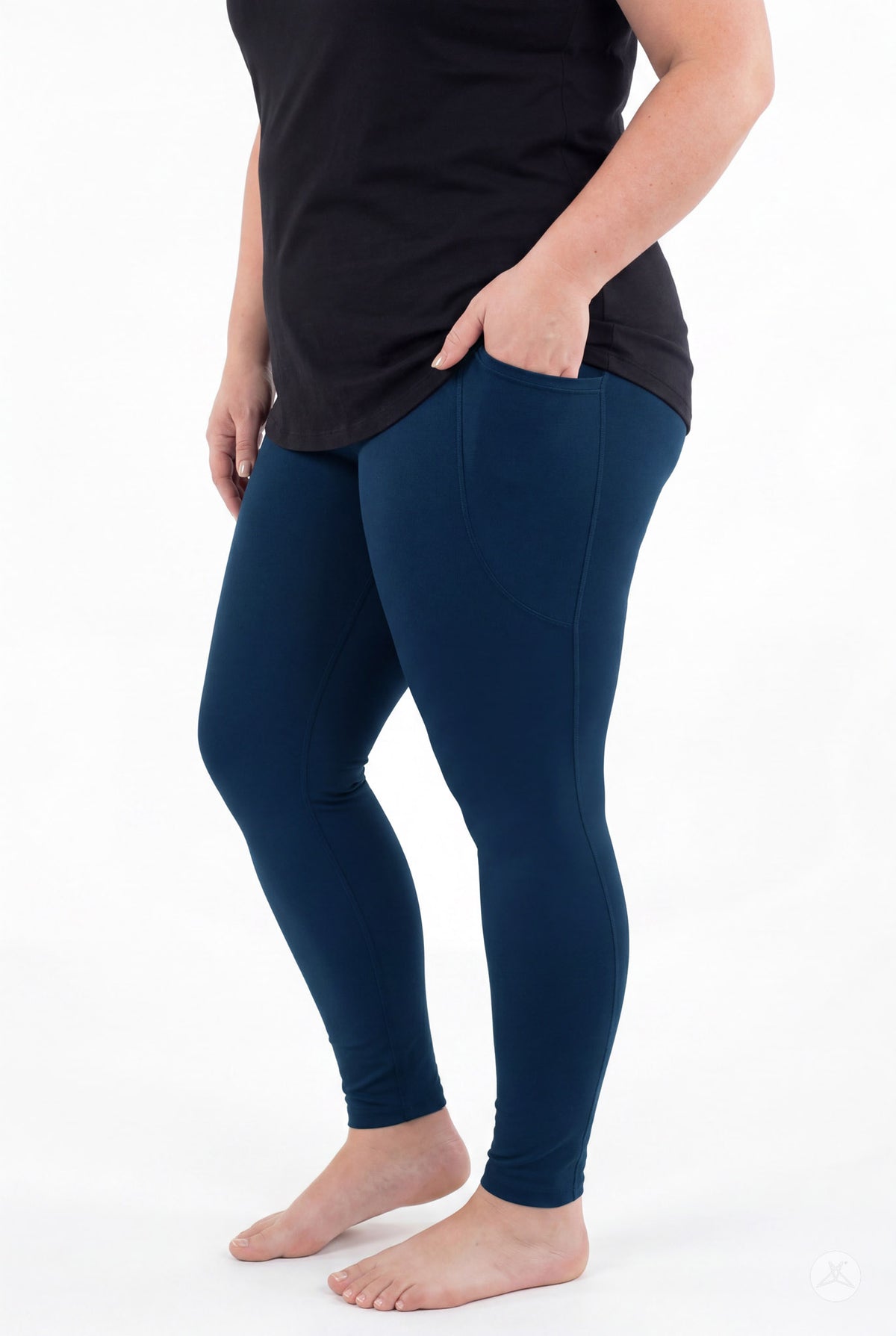 SweetLegs Still Water Pocket Leggings in navy blue worn by a model with a side pocket