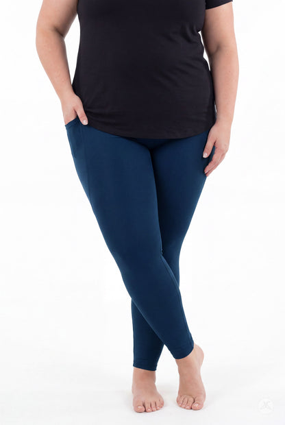Model wearing SweetLegs Still Water Pocket Leggings in deep navy blue
