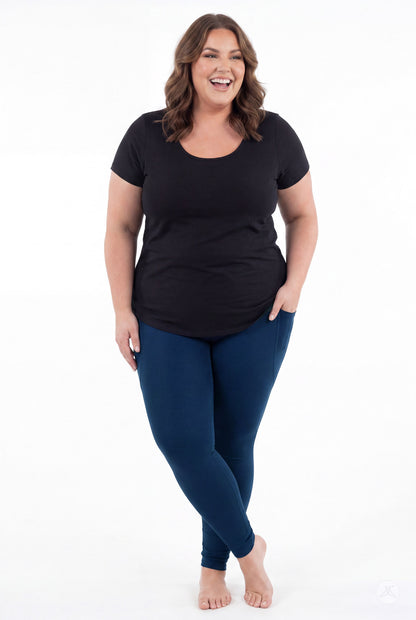 SweetLegs Still Water Pocket Leggings in navy blue worn by a smiling model
